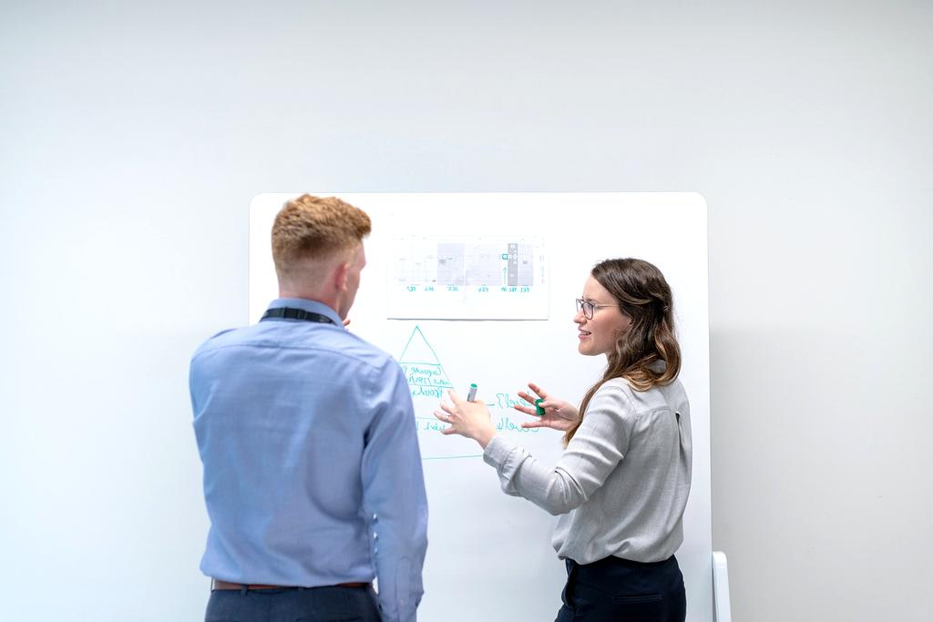 Team of engineers collaborating over renewable energy project plans